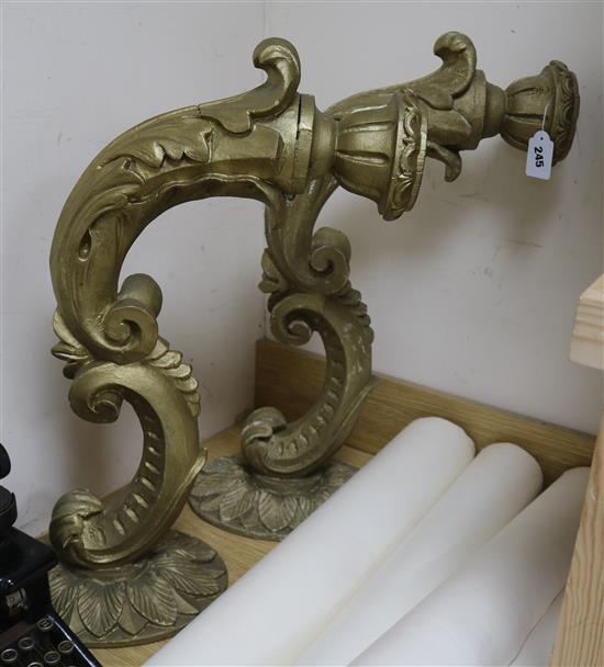A pair of carved wood wall candle sconces